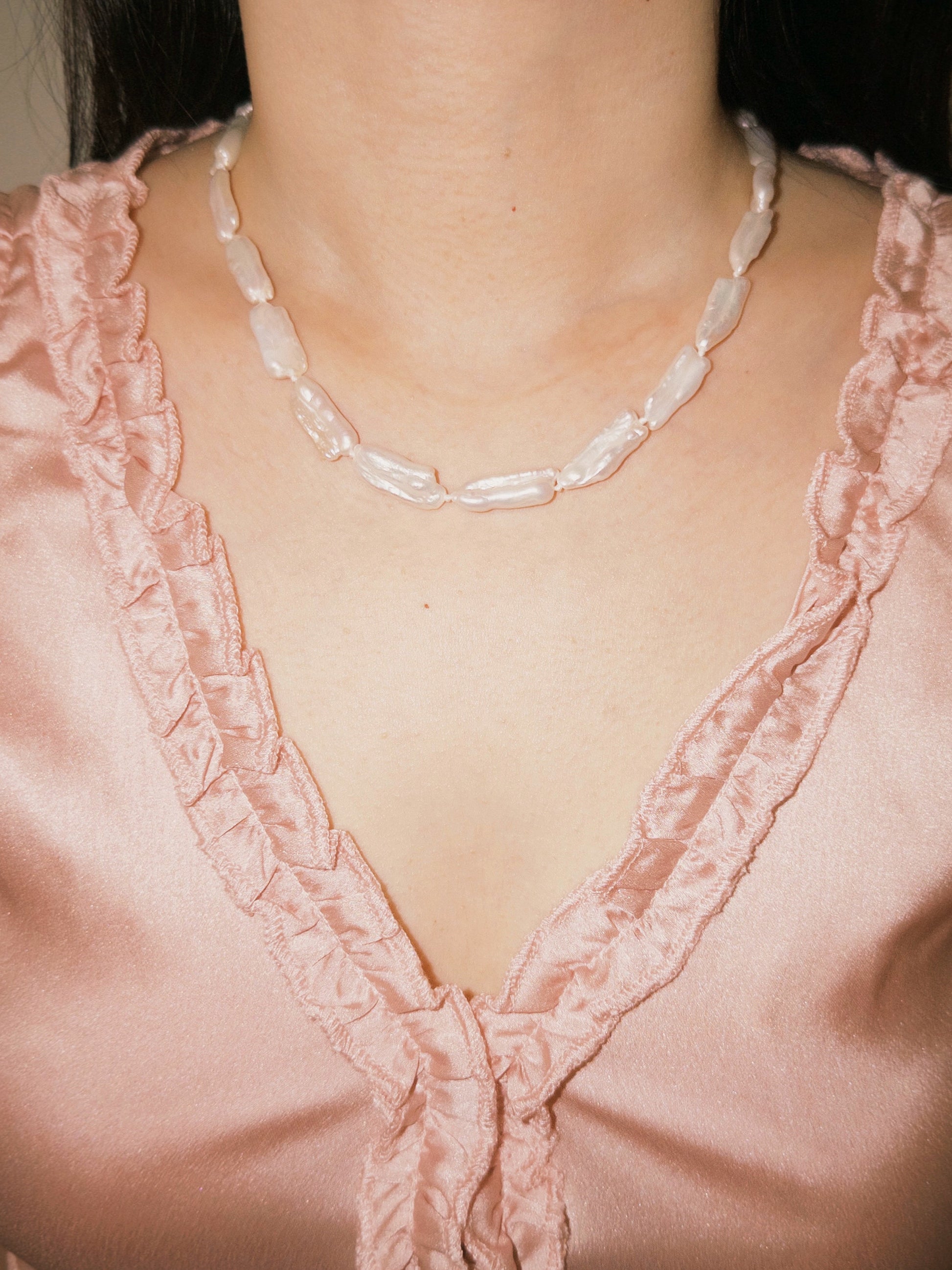 Biwa pearl necklace worn on neck with relaxed everyday styling