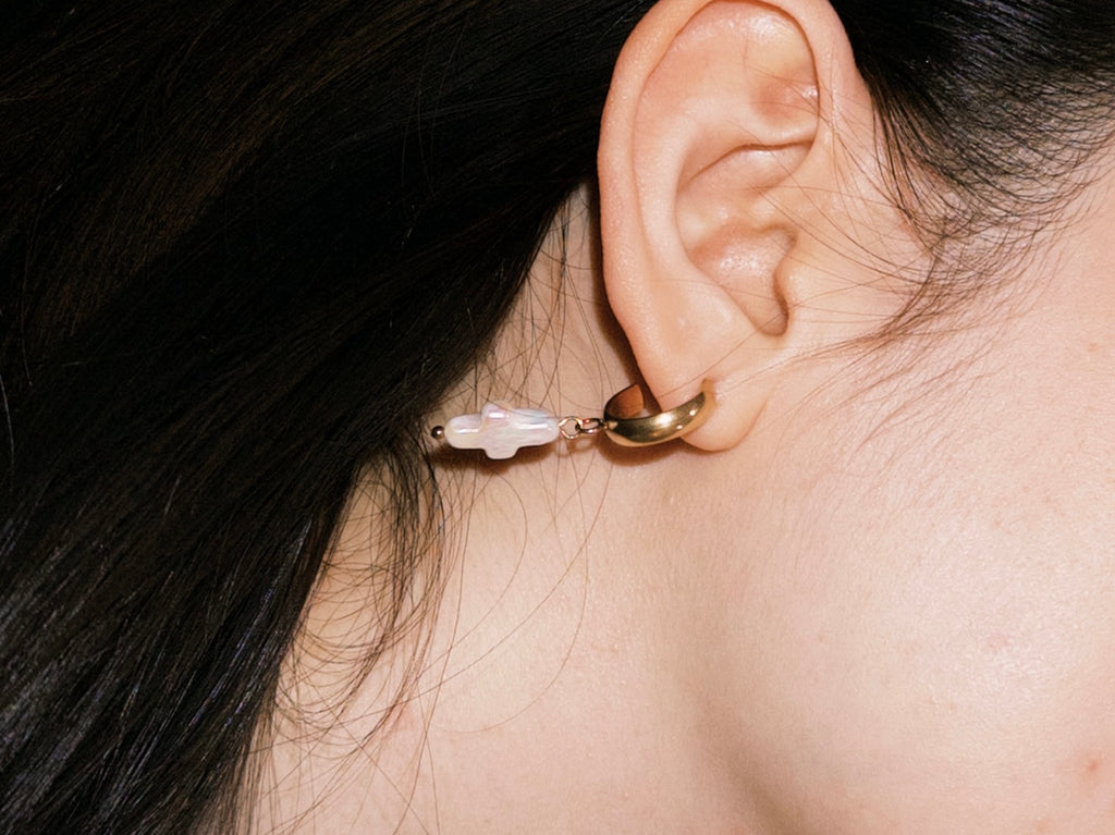 Minimal gold hoop earrings with freshwater pearl cross charms