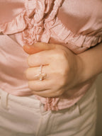 Minimal pearl rings styled with relaxed everyday jewelry