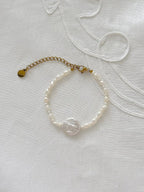 Freshwater pearl bracelet displayed on soft fabric with minimal styling details