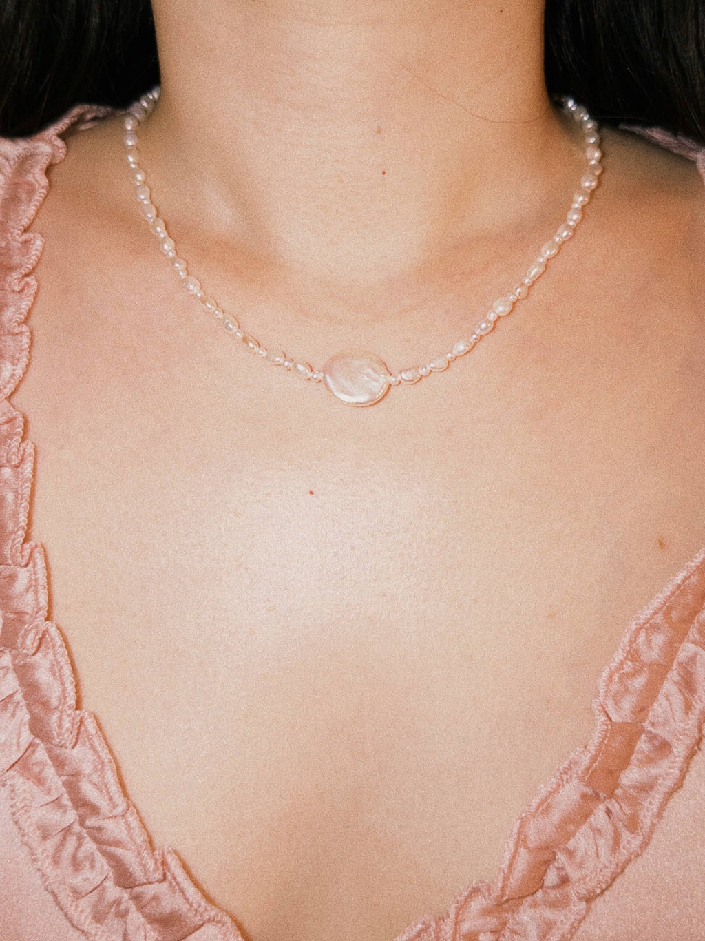Everyday pearl necklace worn naturally with soft minimal styling