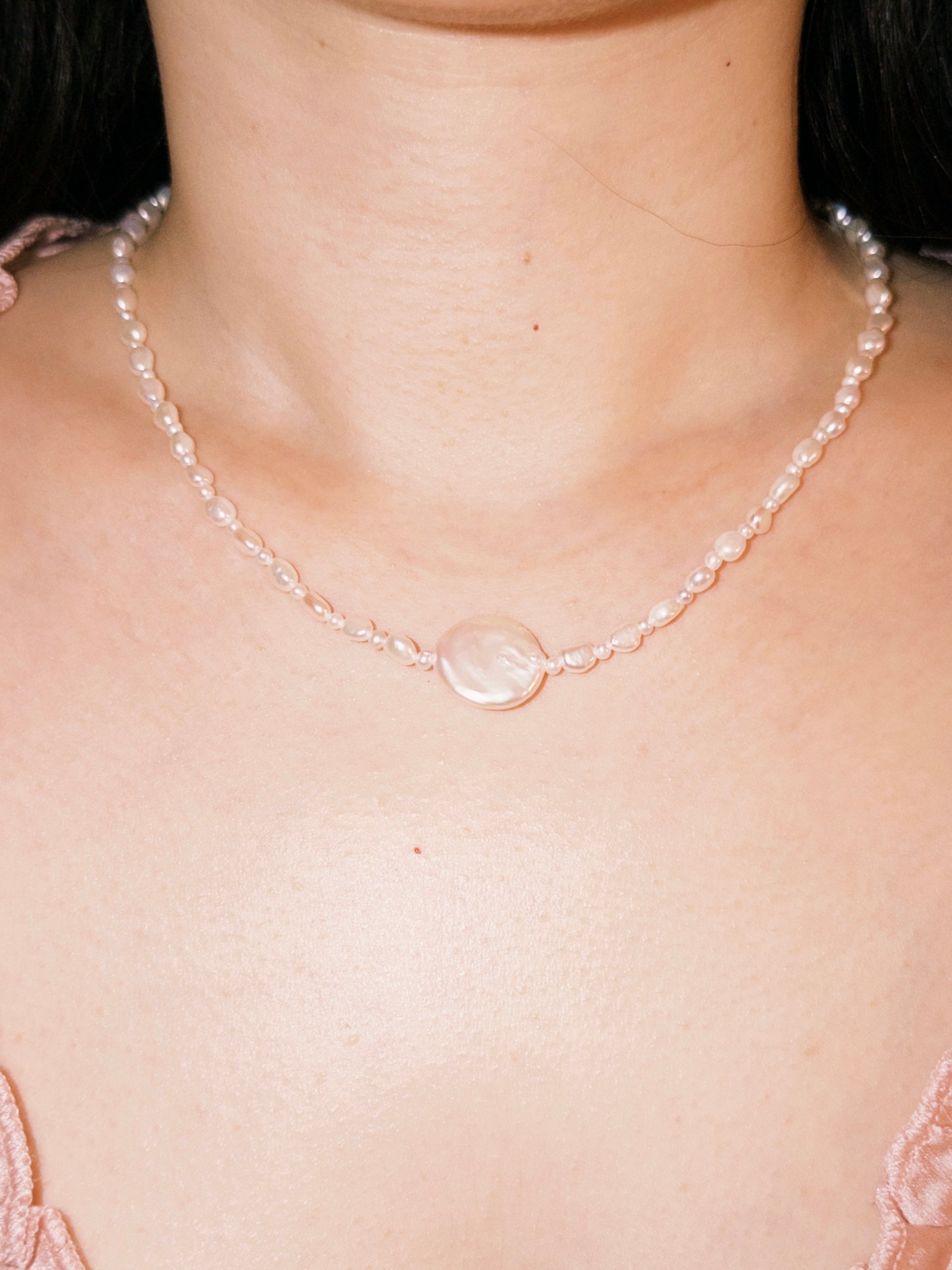 Everyday pearl necklace worn naturally with soft minimal styling