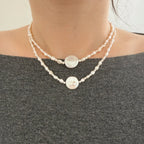 Double layered pearl necklaces styled for lived-in everyday wear