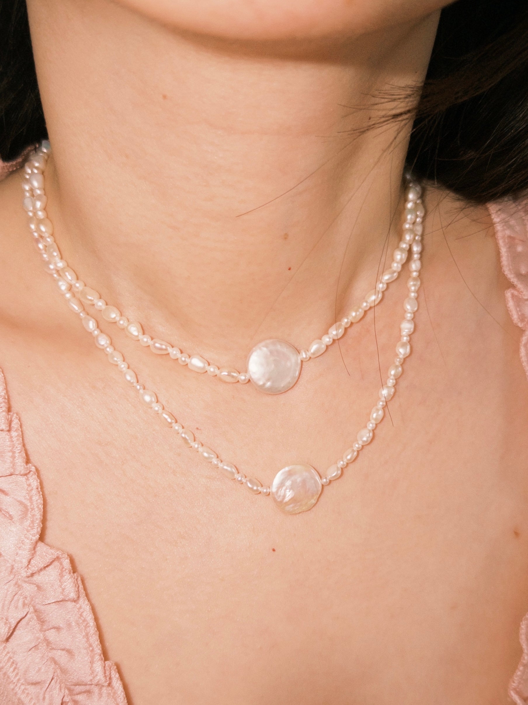 Layered pearl necklaces styled naturally for everyday wear with soft neutral tones