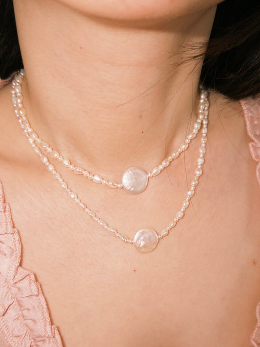 Layered pearl necklaces styled naturally for everyday wear with soft neutral tones