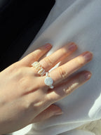 Pearl statement ring photographed in soft natural sunlight