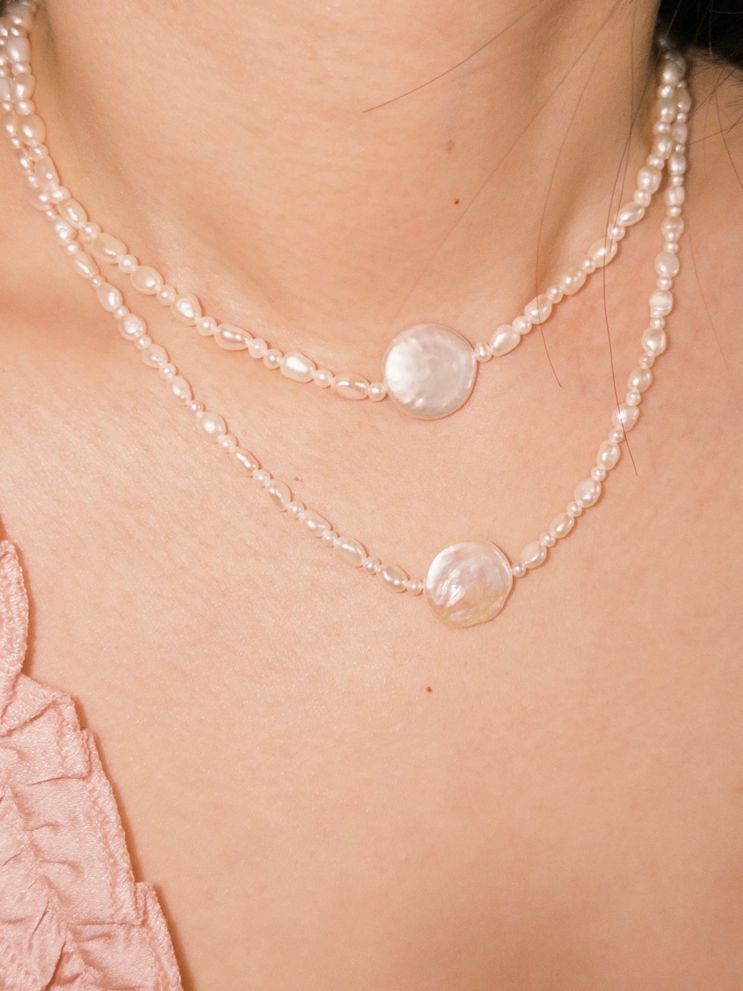 Layered pearl necklaces styled naturally for everyday wear with soft neutral tones