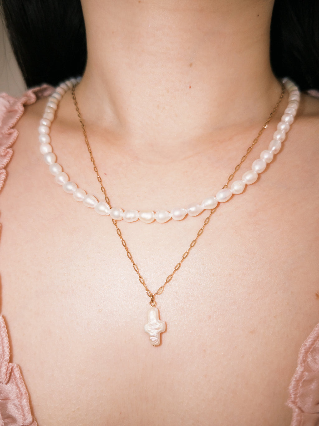 Freshwater pearl necklace layered with gold jewelry for relaxed everyday wear